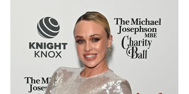 Pregnant Jorgie Porter displays her bump in a sparkly silver dress as she attends charity ball and jokes she could pop out tonight'