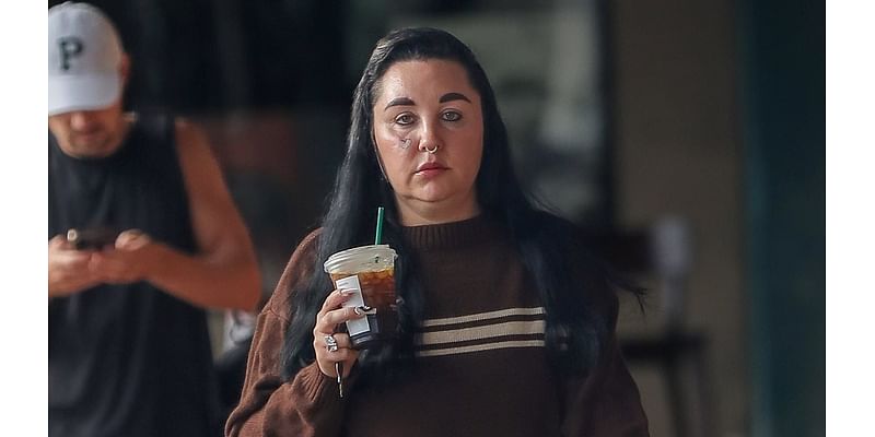 Amanda Bynes steps out for an iced coffee.... after giving fans a look inside her new Los Angeles apartment