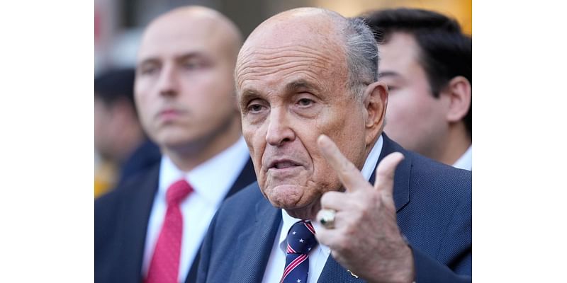 Giuliani says he can't surrender a Joe DiMaggio jersey in $148M defamation case because it's locked up in Ronkonkoma, NY