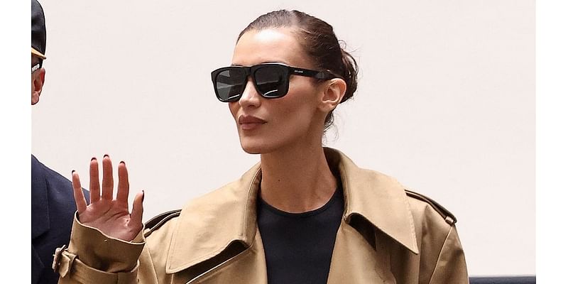 Bella Hadid cuts a stylish figure in a brown trench coat as she heads to a Valentino fitting ahead of Paris Fashion Week