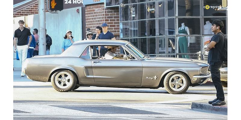 Brooklyn Beckham goes for a spin in his classic Mustang in Los Angeles after adding another car to his impressive collection