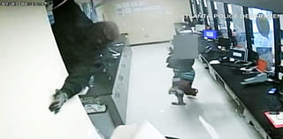 Video shows robbers drop into check cashing store from ceiling in $150,000 heist