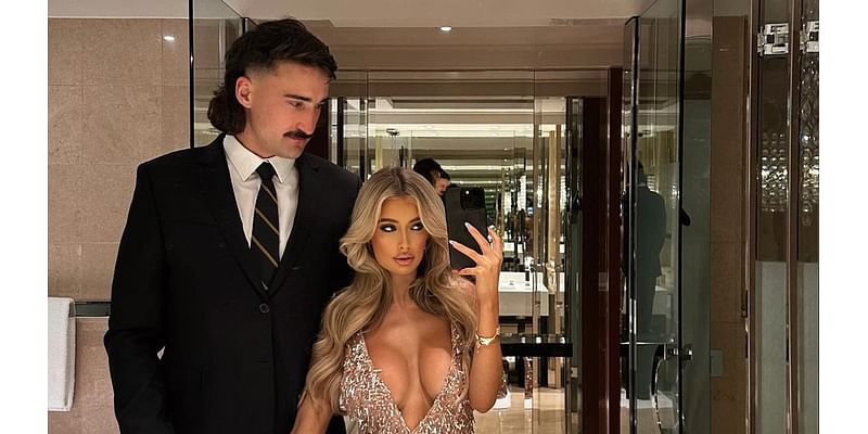 The AFL's most controversial commentator hits the footy star boyfriend of Australia's hottest WAG with a damning insult as the pair get into a war of words