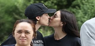 The Veronicas singer Jess Origliasso shares a sweet smooch with fiancée Alex Smith at Sydney Airport as the couple arrive in Australia