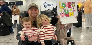 Stacey Solomon playfully swipes at Joe Swash's spelling as he surprises her with a sign at the airport after her Vegas trip - following couple's 'row in the street'