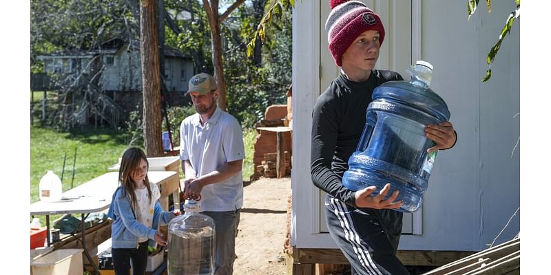 After hurricane, with no running water, residents organize to meet a basic need