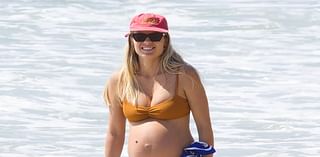 Heavily pregnant Elyse Knowles shows off her baby bump in bikini during beach day in Byron Bay - as she prepares to welcome third child