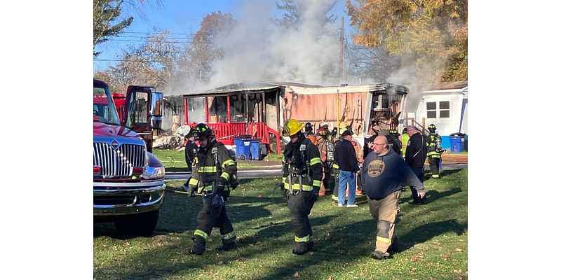 Elbridge man and dog safe after his mobile home catches fire