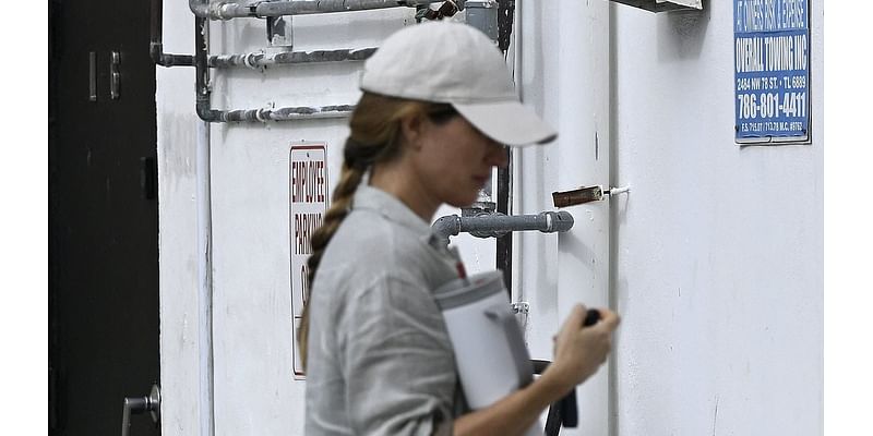 Pregnant Gisele Bundchen looks effortlessly chic in a grey linen shirt as she heads to pilates class in Miami