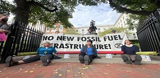 Climate protestors lock themselves to State House gates