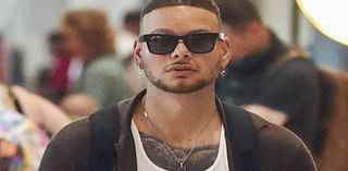 US music star goes incognito as he touches down in Sydney amid his Australian tour