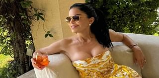 Lauren Sanchez, 54, flaunts her cleavage in a low-cut designer dress while sipping on an Aperol spritz as she enjoys summer getaway with billionaire fiance Jeff Bezos