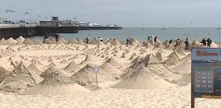 son duo build hundreds of pyramids on beach