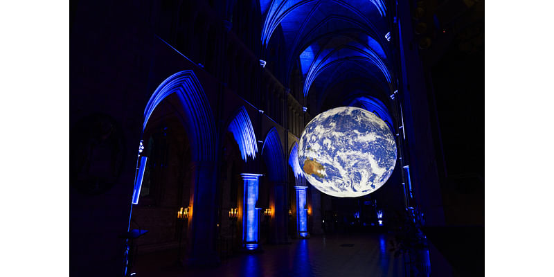 There’s a huge, glowing, spinning planet Earth at Southwark Cathedral