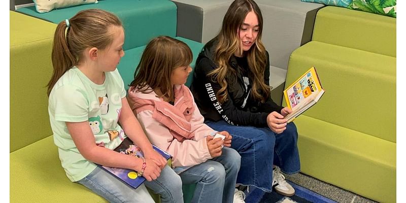 High schoolers read to elementary children: 'It's always nice to come back'