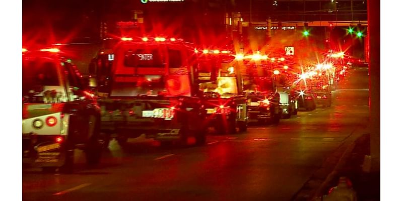 Tow truck lights shine to remember worker’s death a year ago