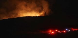 Fire burns hillside along Highway 101 in Pismo Beach