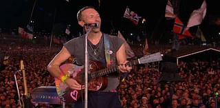 Whoever got knighted wearing shorts! Coldplay's Chris Martin honours wheelchair-bound Glastonbury founder Sir Michael Eavis, 88, in touching on-stage tribute before inviting Michael J Fox to join him 
