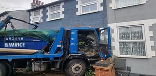 Family reveal horror after a skip lorry crashed through the front of their house killing their cat and leaving them homeless