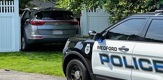 Five teens arrested after stolen SUV crashes through fence at Medford home