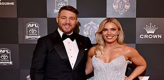 Abbey Holmes stuns in a glistening silver gown as she and Dale Thomas lead arrivals at Brownlow Medal 2024 as AFL's night of nights kicks off at Crown Melbourne