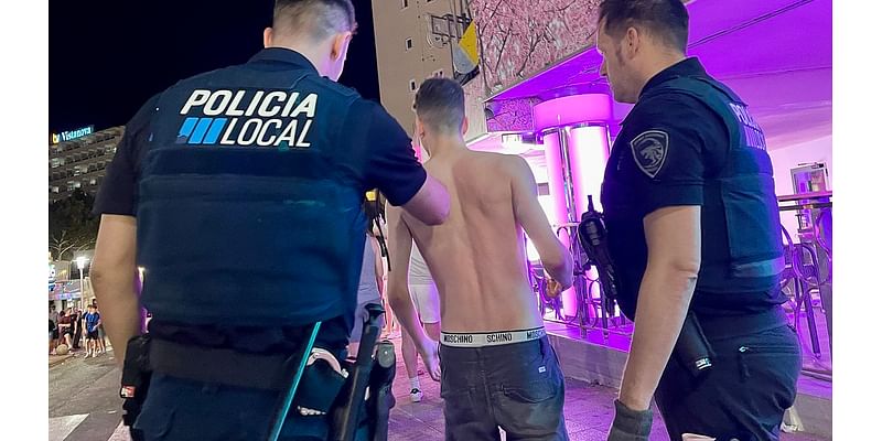 Police manhunt after two groups of British tourists battle each other in huge brawl on notorious Magaluf strip close to spot where Irish father collapsed and died