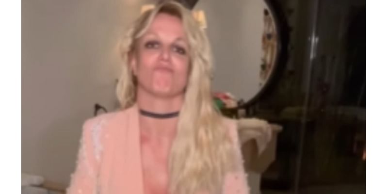 Britney Spears wishes fans a 'wonderful weekend' as she dances in a bikini top and cut-off shorts... after ex Justin Timberlake's DWI arrest