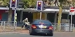 Heart-stopping moment woman pushing a pram narrowly avoided getting run over by driver during high-speed police chase