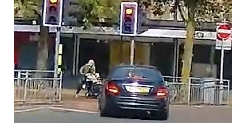 Heart-stopping moment woman pushing a pram narrowly avoided getting run over by driver during high-speed police chase