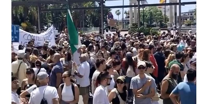 More than 15,000 Malaga residents join anti-tourism demo amid claims they are 'strangers in their own city' after being 'overrun' by foreign visitors