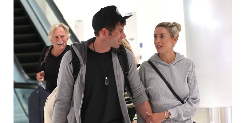 Tarek El Moussa holds hands with wife Heather Rae Young as they jet into LA - after opening up about filming new show with ex Christina Hall