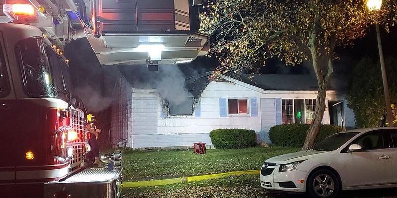 Firefighters battle house fire in Lansing early Wednesday