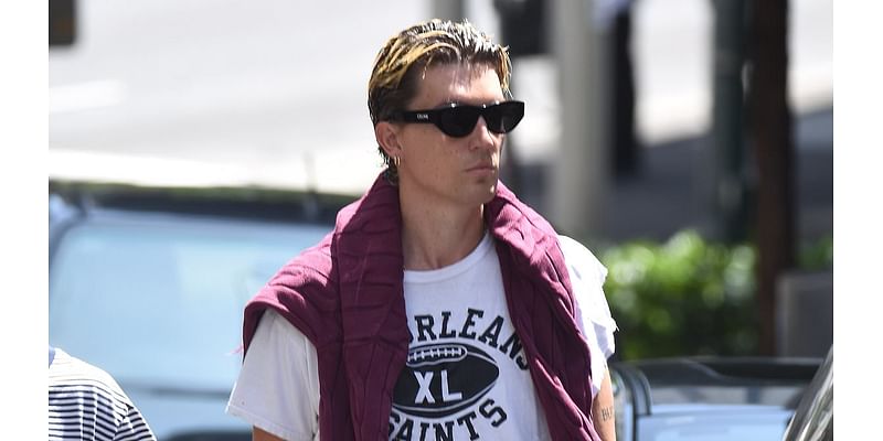 Dua Lipa's ex Paul Jason Klein cuts a stylish figure as he is spotted on coffee run in Sydney - after revealing he is 'fortunate' to be alive following Vespa accident