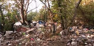 Woman’s body found stuffed in suitcase in trash pile near homeless camp