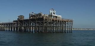 Demolition begins for building burned in Oceanside Pier fire