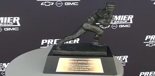 Heisman Memorial Trophy comes to Morgantown car dealership