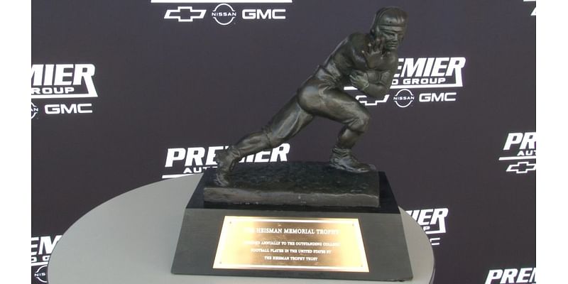 Heisman Memorial Trophy comes to Morgantown car dealership