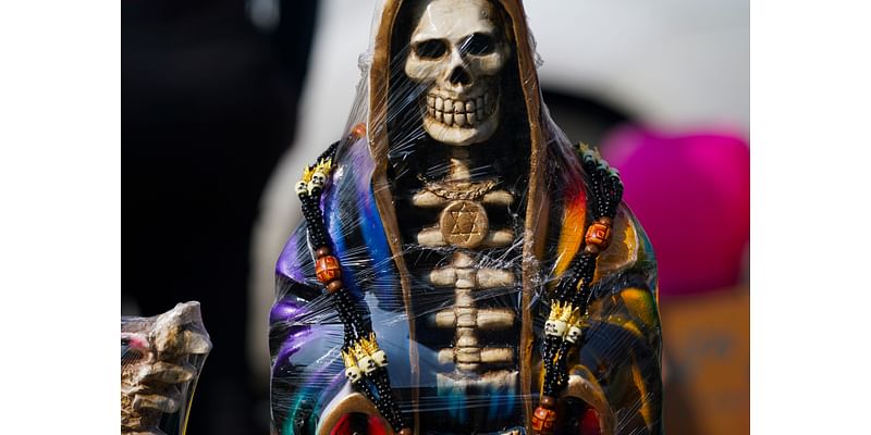 A leader of Mexican folk saint cult 'La Santa Muerte' is killed at an altar to the skeletal figure