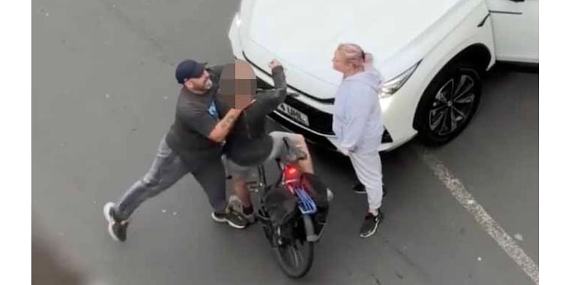 Moment man 'throttles' cyclist and throws him off his bike in shocking road rage attack