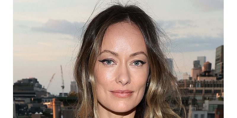 Olivia Wilde nearly spills out of her perilously plunging blue dress as she joins Lucy Liu at the Tribeca Chanel cocktail party in NYC