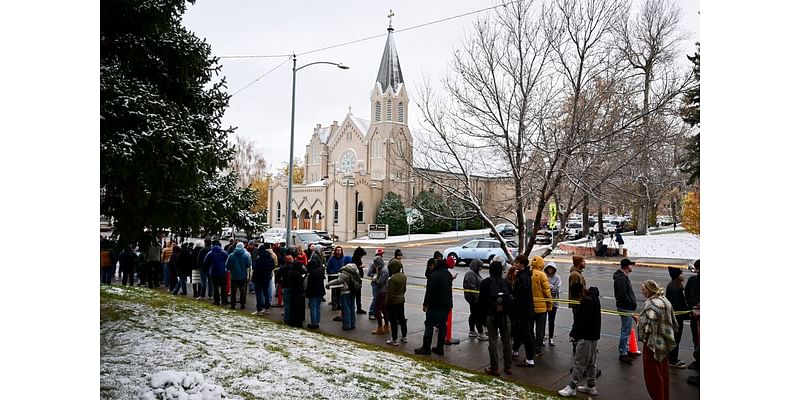 Free pizza and a DJ help defrost Montana voters lined up until 4 a.m. in the snow to vote