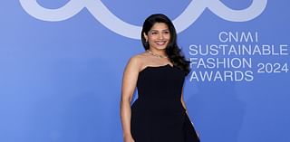 Freida Pinto looks radiant in a sweeping black evening gown as she makes a red carpet appearance at the CNMI Sustainable Fashion Awards