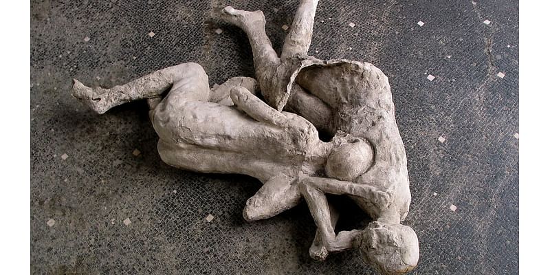 The 'two maidens' of Pompeii may have been GAY LOVERS, scientists say - after reanalysing the iconic preserved figures found wrapped in a poignant embrace