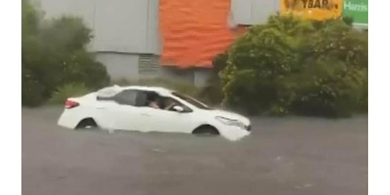 Roads turn to rivers as drivers are stranded in their cars amid raging flood waters and thousands are left without power following 'supercell' storm in Victoria and South Australia