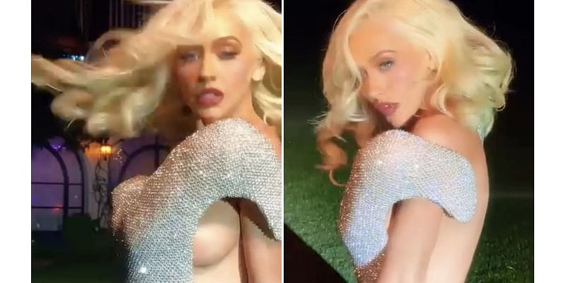 Christina Aguilera posts sizzling video showing off side boob as she dances in silver dress