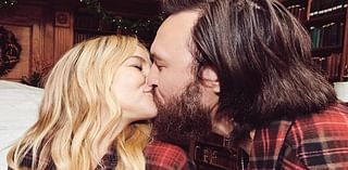 Kate Hudson kisses fiancé Danny Fujikawa while wearing matching PJs for annual holiday card after opening up about the dynamics of her 'patchwork' family