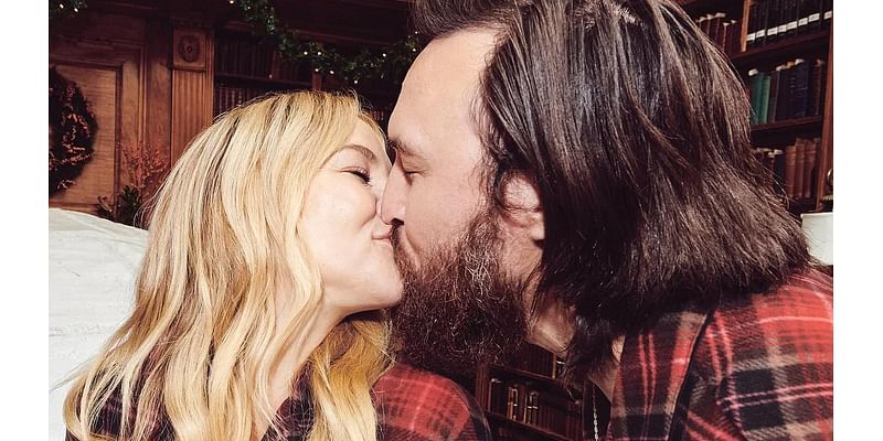 Kate Hudson kisses fiancé Danny Fujikawa while wearing matching PJs for annual holiday card after opening up about the dynamics of her 'patchwork' family