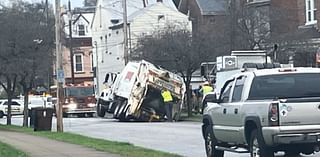 Rumpke truck stuck in sink hole in NKY