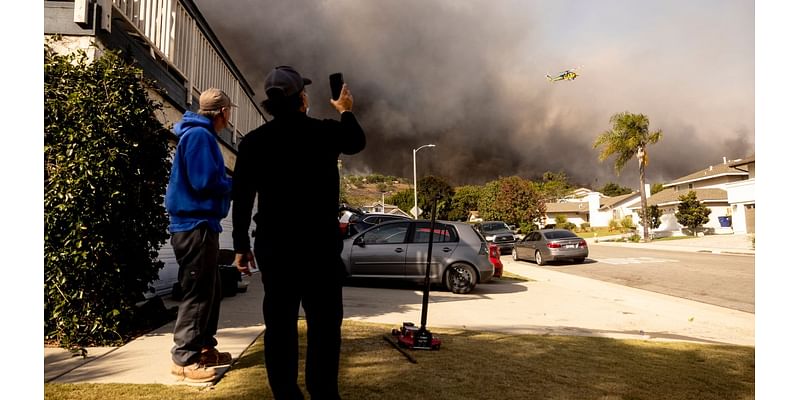 Firefighters race to protect homes from wind-driven Mountain Fire in Ventura County