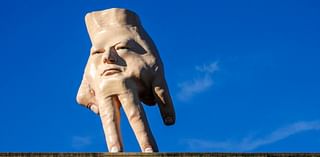 Controversial giant hand's removal from top of New Zealand building is proving controversial